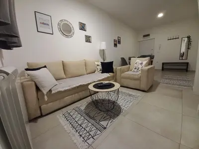 a living room with a couch and a table at Jans Belgrade in Belgrade