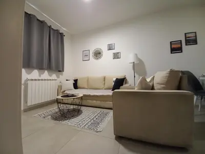 a living room with a couch and a table at Jans Belgrade in Belgrade