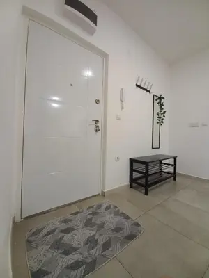 a room with a white door and a table at Jans Belgrade in Belgrade