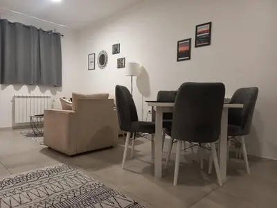 a dining room with a table and chairs at Jans Belgrade in Belgrade