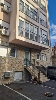a apartment building with stairs and a balcony at Jans Belgrade in Belgrade