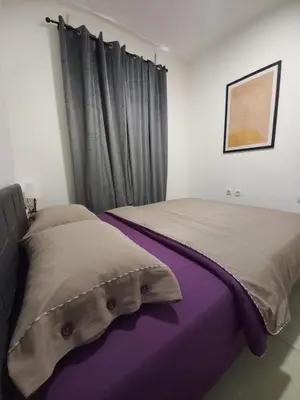 a bedroom with two beds and a window at Jans Belgrade in Belgrade