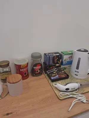 a counter with various food ingredients on it at Apartman LUX Jelena in Surčin