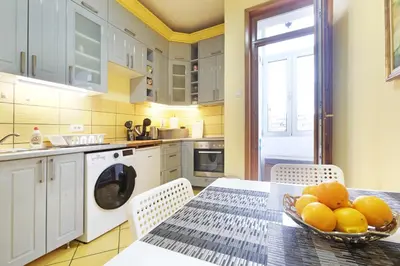 a kitchen with a table with a bowl of fruit on it at Relax Home Downtown Apartment in Belgrade
