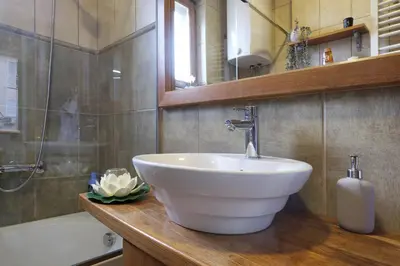 a bathroom with a white sink and a bath tub at Relax Home Downtown Apartment in Belgrade