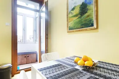 a table with a bowl of fruit on it at Relax Home Downtown Apartment in Belgrade