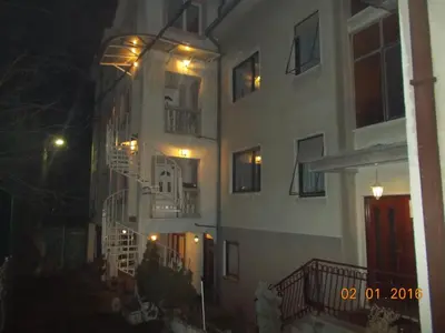 a building with lights on the side of it at night at Apartment Gajic in Belgrade