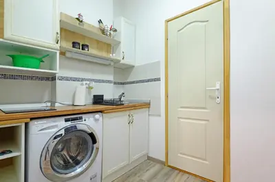 a laundry room with a washer and dryer at Apartment Paradise Nice Home in Belgrade