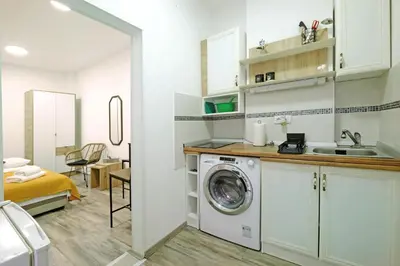 a kitchen with a washing machine in a room at Apartment Paradise Nice Home in Belgrade