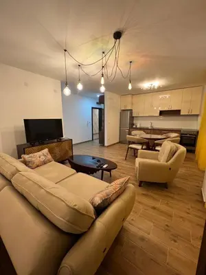 a living room with a couch and a table at STAN NA DAN MILA in Irig