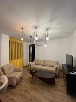 a living room with a couch and a table at STAN NA DAN MILA in Irig