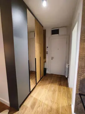 an empty room with a hallway with a mirror at Aria in Belgrade