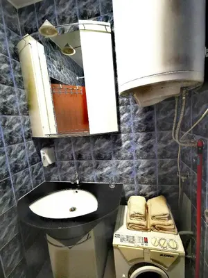 a bathroom with a sink and a mirror at Apartman Mirka 1 in Karaburma