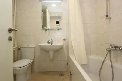 a bathroom with a toilet and a sink and a shower at Evergreen - studio in Belgrade to relax and enjoy, parking 5 eur per day in Belgrade