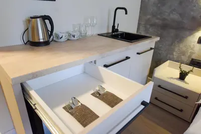 a kitchen with a sink and a counter top at HOTEL Iva Old Town in Belgrade