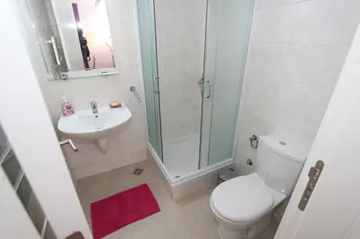 a bathroom with a shower and a toilet and a sink at Aleksandar - Stan Na dan Belvil Novi Beograd in Belgrade