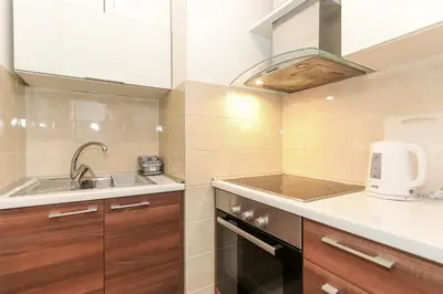 a small kitchen with a sink and a counter top at Portago - Stan na dan Belvil Novi Beograd in Belgrade