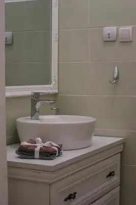 a bathroom with a white sink and a mirror at Golden Velvet apartment Belgrade in Belgrade