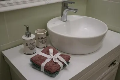 a bathroom counter with a sink and a sink at Golden Velvet apartment Belgrade in Belgrade