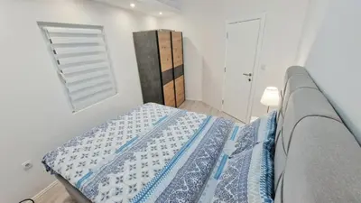 a bed in a room with a window at Zeus in Zemun