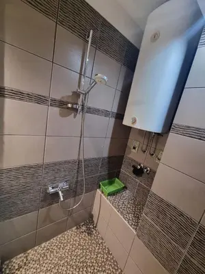 a shower with a glass door in a bathroom at Hawaii- 2 bdr, Arena, Sava centar, FREE PARKING in Novi Beograd