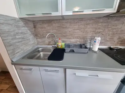 a kitchen counter with a sink and a sink at Hawaii- 2 bdr, Arena, Sava centar, FREE PARKING in Novi Beograd