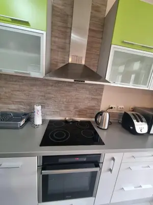 a kitchen with a stove top oven in a kitchen at Hawaii- 2 bdr, Arena, Sava centar, FREE PARKING in Novi Beograd