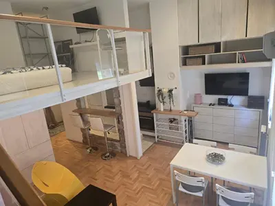 a small room with a desk and bunk beds at Apartman Stepa K3 in Belgrade