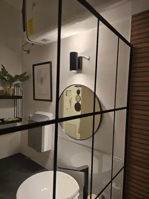 a bathroom with a toilet and a mirror at Apartman Stepa K3 in Belgrade