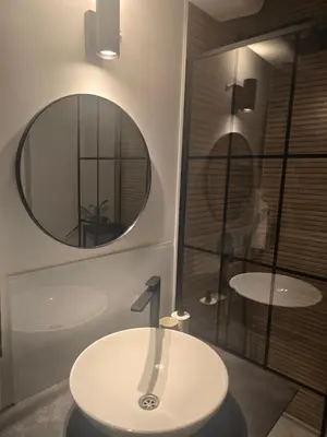 a bathroom with a sink and a mirror at Apartman Stepa K3 in Belgrade