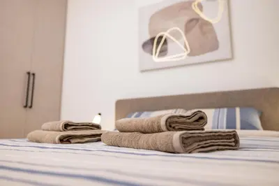a group of towels sitting on top of a bed at Belgrade Waterfront Cozy Symphony 2 in Sajmište