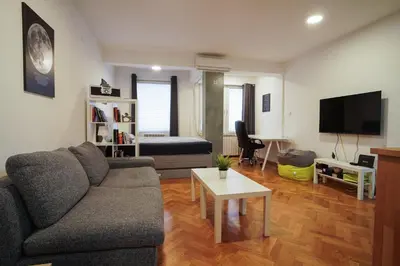 a living room with a couch and a table at Apartment Grau in Žarkovo