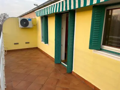 a balcony of a house with a tv on the side at Silicon Valley studio in Belgrade