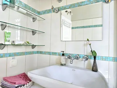 a bathroom with a white sink and a mirror at Apartman Didi in Belgrade