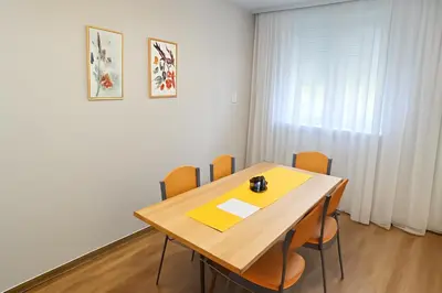 a dining room with a table and chairs at Apartman Beograd Banovo Brdo - lux dvosoban stan in Belgrade