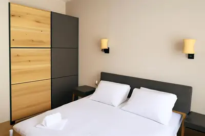 a bedroom with a bed with two white pillows at Apartman Beograd Banovo Brdo - lux dvosoban stan in Belgrade