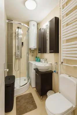 a bathroom with a shower and a toilet and a sink at ART residence Cara Urosa in Belgrade