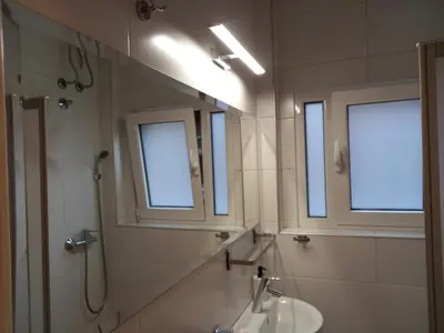 a bathroom with a sink and a mirror at TITO in Belgrade