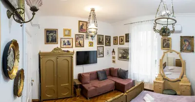 a living room with a couch and a tv at Natalie's Gallery in Belgrade