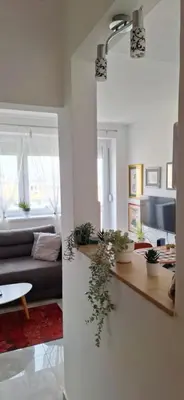 a living room with a couch and a table at Apartman u Zemunu in Zemun