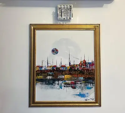 a picture of a painting of a ship on a wall at Athens Apartment City Center in Belgrade