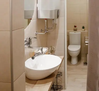 a bathroom with a sink and a toilet at Athens Apartment City Center in Belgrade