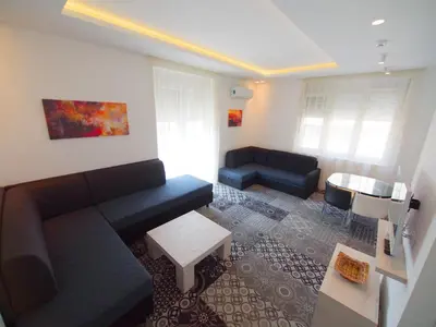 a living room with a couch and a table at Decanska Apartments in Belgrade