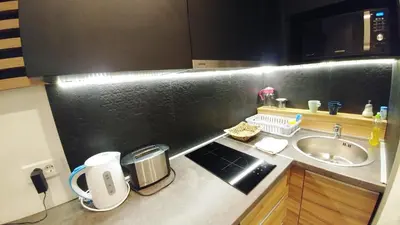 a small kitchen with a sink and a counter top at Decanska Apartments in Belgrade