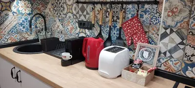 a kitchen counter with various appliances on a counter top at Azulejo Apartment in Novi Beograd