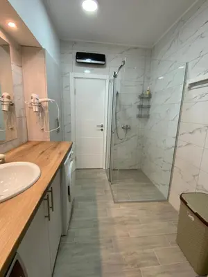a bathroom with a shower and a sink at Filmski grad Apartmani in Filmski Grad