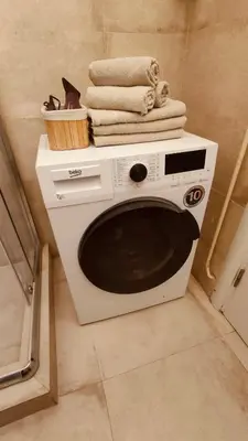 a microwave in a bathroom with towels on top of it at Top Republic in Belgrade