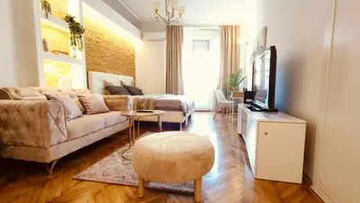 a living room with a couch and a tv at Top Republic in Belgrade
