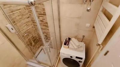 a small bathroom with a shower and a toilet at Top Republic in Belgrade