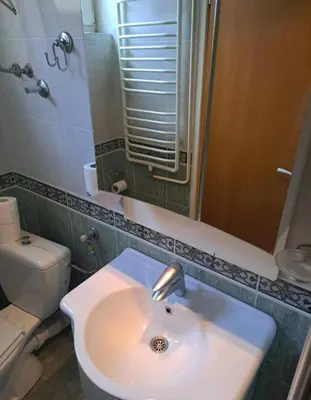 a bathroom with a sink and a toilet at Apartman 2001 Stari grad in Belgrade